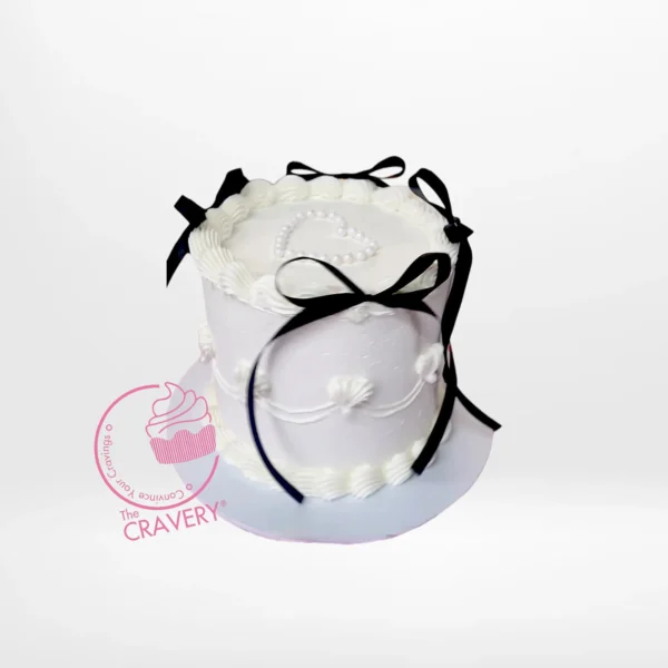 Vintage Black Bows Cake – A timeless cake with floral and lace patterns, ideal for elegant celebrations in Birmingham.