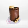 Luxurious chocolate explosion cake topped with assorted chocolates, handcrafted by The Cravery Cake Shop in Birmingham.