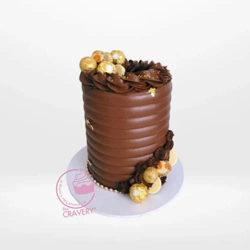 Luxurious chocolate explosion cake topped with assorted chocolates, handcrafted by The Cravery Cake Shop in Birmingham.