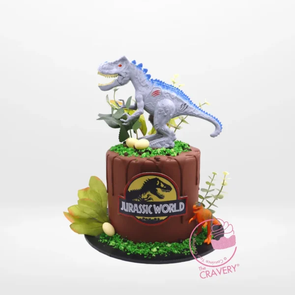 Jurassic World Cake with dinosaurs, rocks, and plants from The Cravery Cake Shop Erdington.