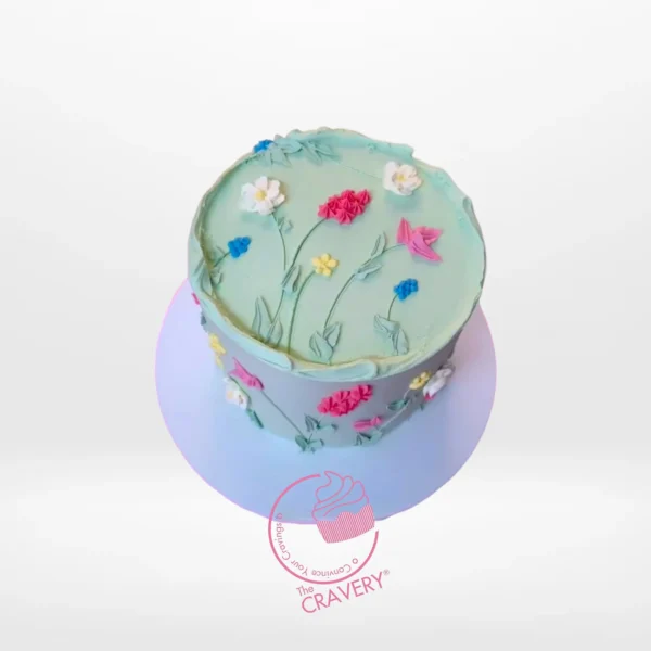 Cake Decorated with Flowers by The Cravery, elegant floral design handcrafted by cake artist in Solihull.