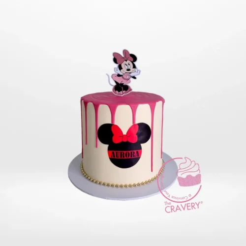 Minnie Mouse Birthday Cake with pink polka dots and Minnie bow by The Cravery, expert cake makers in Birmingham.