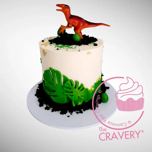 Simple Dinosaur Cake with non-edible dinosaur topper handcrafted by The Cravery, available for birthday cakes delivered in Birmingham.