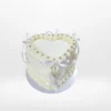 Heart Cake White – A romantic heart-shaped cake adorned with pink frosting and non-edible bows, perfect for celebrations in Birmingham.