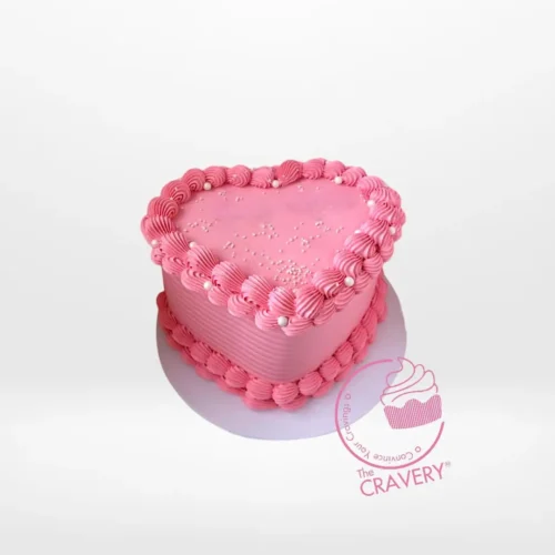 Heart Pink Cake – A romantic pink cake adorned with sugar pearls and fondant hearts, perfect for celebrations in Birmingham.