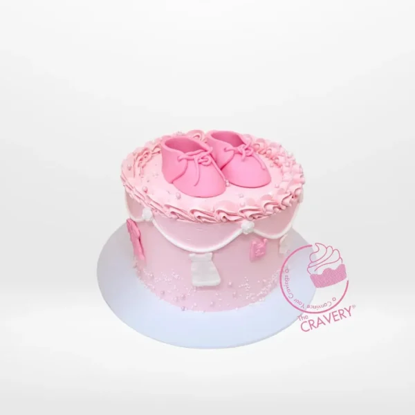Babyshower Cake Shoe from cake shop Solihull – A delightful baby shower creation.