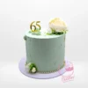65th Birthday Cake from Cravery’s Birthday Cake Delivery Birmingham Collections. A bespoke creation adorned with non-edible flowers for your milestone celebration.
