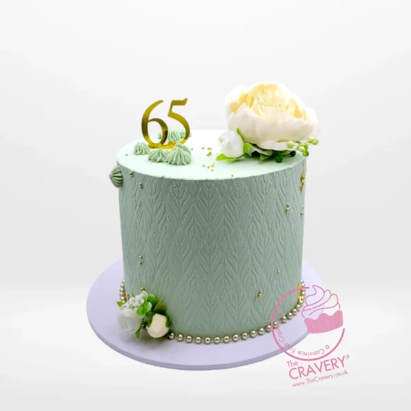 65th Birthday Cake from Cravery’s Birthday Cake Delivery Birmingham Collections. A bespoke creation adorned with non-edible flowers for your milestone celebration.