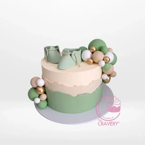Babyshower Cake with Shoe from Cravery's Babyshower Cakes Delivered Birmingham Service, the perfect cake for a whimsical baby shower.