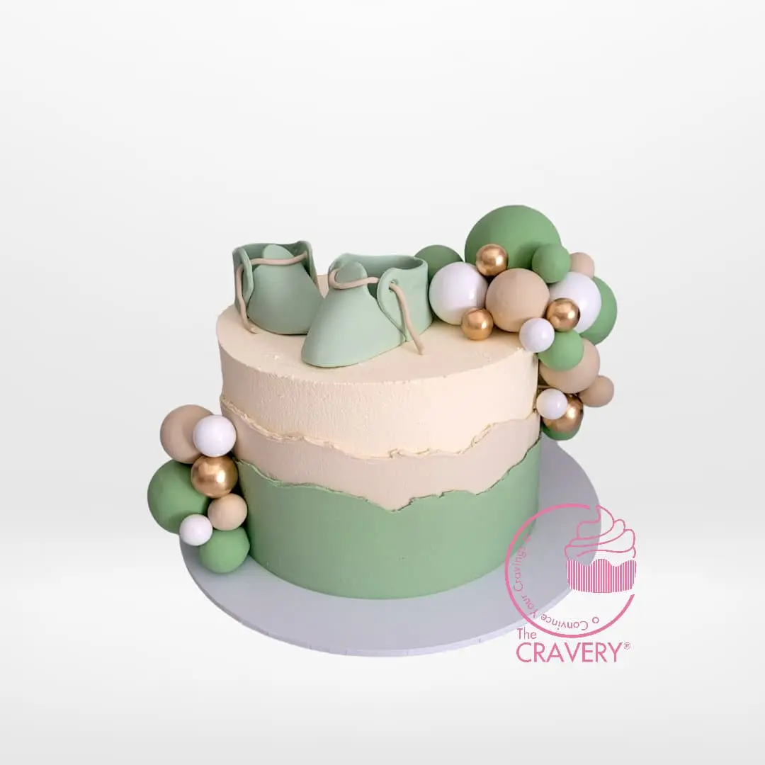 Babyshower Cake with Shoe from Cravery's Babyshower Cakes Delivered Birmingham Service, the perfect cake for a whimsical baby shower.