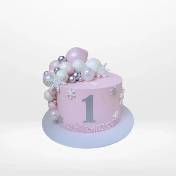 1st birthday cake with smooth buttercream finish and elegant decorative details handcrafted in Birmingham.