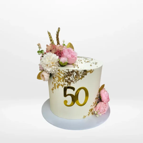Female 50th Birthday Cake from Cravery’s cake shop Moseley with elegant floral and fan design.
