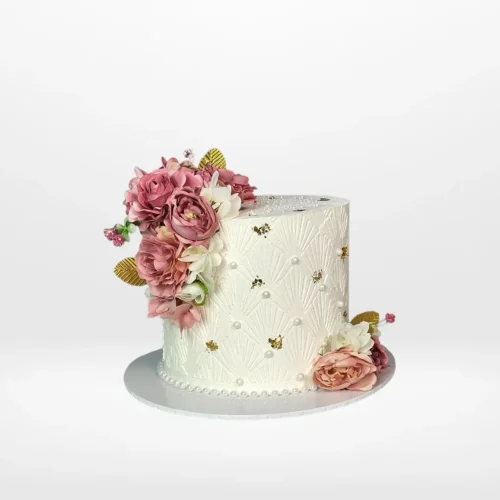 Flower cake with elegant decorative details and smooth buttercream finish handcrafted in Birmingham.