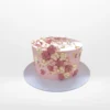 Pink cake cake with smooth buttercream finish and elegant decorative details handcrafted in Birmingham.