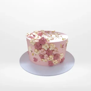 Pink cake cake with smooth buttercream finish and elegant decorative details handcrafted in Birmingham.