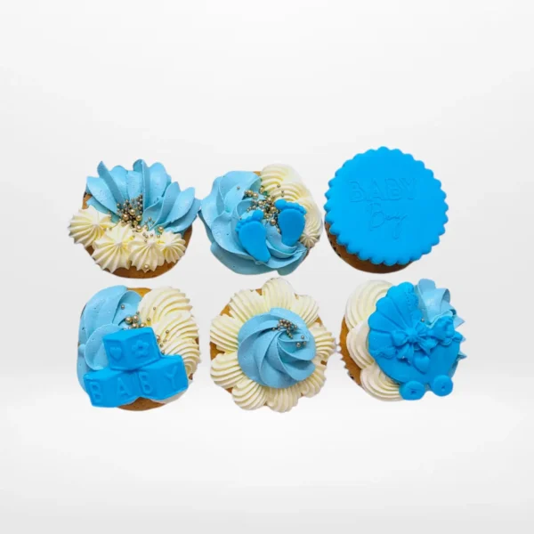 Babyshower Cupcakes for Boy by The Cravery, blue and white cupcakes with buttercream frosting and baby-themed decorations, baked fresh in Birmingham.