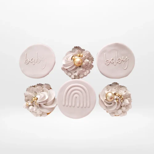 Baby shower cupcakes with soft colours and decorative buttercream made in Birmingham.