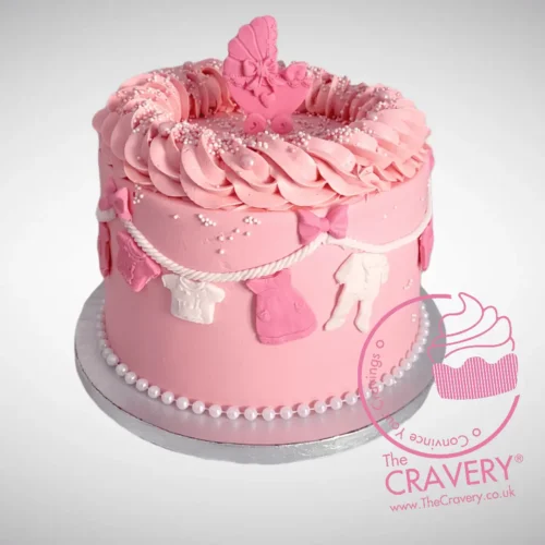 Pink Babyshower Cake decorated with clothes line theme, handcrafted by The Cravery Cake Makers in Solihull.