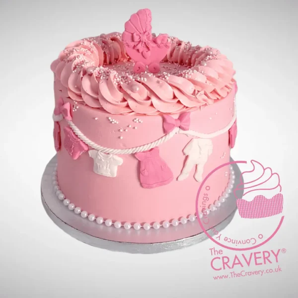 Pink Babyshower Cake decorated with clothes line theme, handcrafted by The Cravery Cake Makers in Solihull.