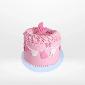 Pink Babyshower Cake decorated with clothes line theme, handcrafted by The Cravery Cake Makers in Solihull.