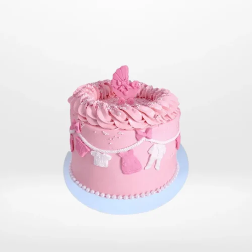 Pink Babyshower Cake decorated with clothes line theme, handcrafted by The Cravery Cake Makers in Solihull.