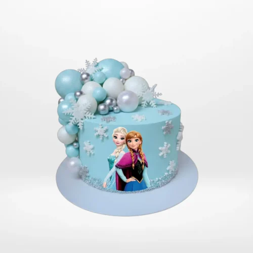 Frozen Cake decorated with Disney Frozen miniatures handcrafted by The Cravery, cake shop Birmingham.