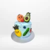 Cute fruit themed cake with character designs and colourful decoration made in Birmingham.