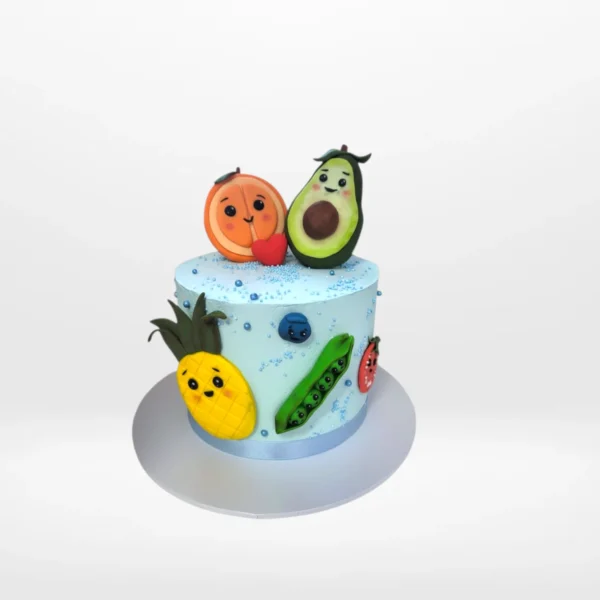 Cute fruit themed cake with character designs and colourful decoration made in Birmingham.