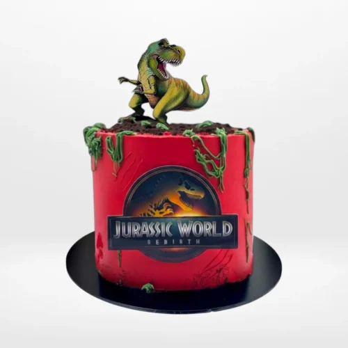 Jurassic World Cake with dinosaurs, rocks, and plants from The Cravery Cake Shop Erdington.