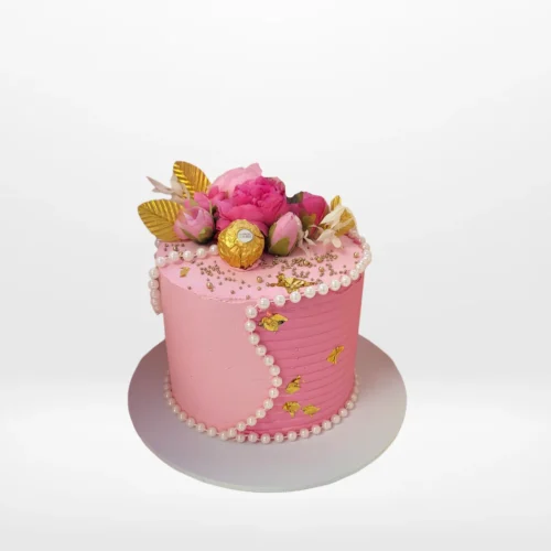 Pink celebration cake with smooth buttercream finish made in Birmingham.