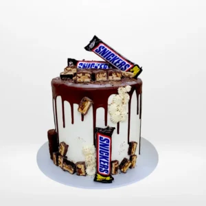 Snickers Cake by The Cravery, handcrafted chocolate-inspired design topped with Snickers bars, among the best birthday cakes in Birmingham.