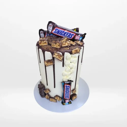 Snickers Cake by The Cravery, handcrafted chocolate-inspired design topped with Snickers bars, among the best birthday cakes in Birmingham.