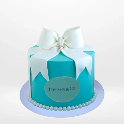 Elegant Tiffany Cake in signature blue with white ribbon and bow, handcrafted by The Cravery Cake Shop Walsall.