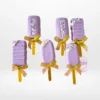 Handcrafted cakesicles decorated with chocolate and elegant designs.