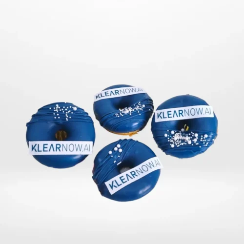 Branded doughnut with edible printed logo topper, freshly crafted for doughnut Birmingham events.