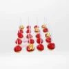 Red coloured cake pops with elegant decorative details, handcrafted by cake makers in Birmingham.