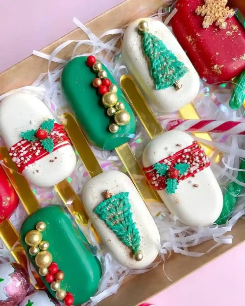 Christmas cakesicle decorated with festive chocolate designs, handcrafted by the best cake shop in Birmingham.