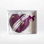 Chocolate heart smash with wooden hammer and hidden sweets, handcrafted by a cake artist in Solihull.