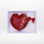 Chocolate smash heart with wooden hammer and hidden sweets, handcrafted by a cake artist in Solihull.
