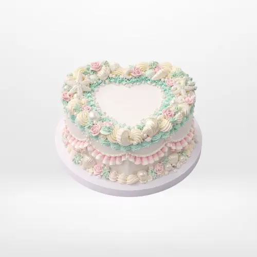 Vintage heart-shaped birthday cake with elegant buttercream piping in Birmingham.