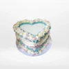 Vintage heart-shaped birthday cake with elegant buttercream piping in Birmingham.