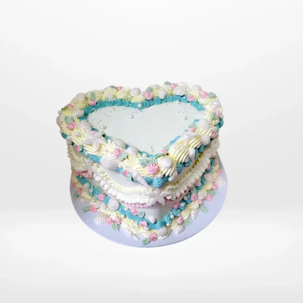 Vintage heart-shaped birthday cake with elegant buttercream piping in Birmingham.