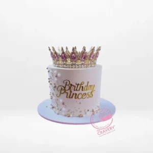Princess tiara birthday cake with pink buttercream and royal decorations from a cake shop in Birmingham.