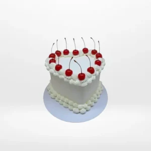 Heart shaped birthday cake with buttercream piping and personalised message in Birmingham.