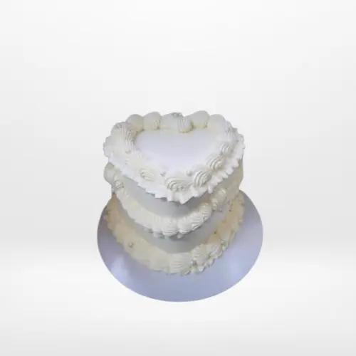 Small heart-shaped birthday cake with buttercream decoration in Birmingham.