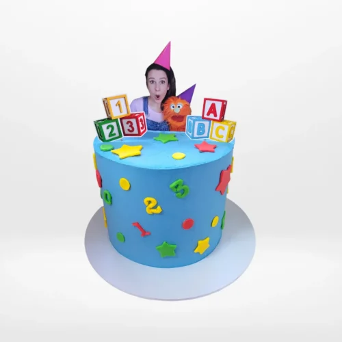 Miss Rachel themed birthday cake with colourful design and character styling made in Birmingham.