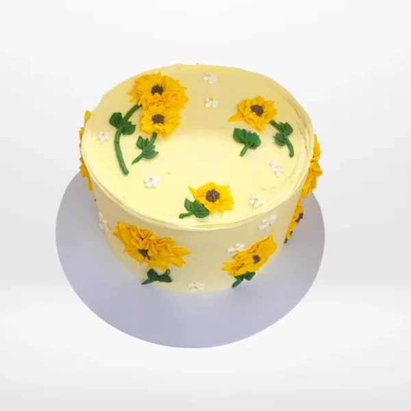 Strawberry cupcakes with pink buttercream swirls and fondant strawberries with floral decoration made in Birmingham.