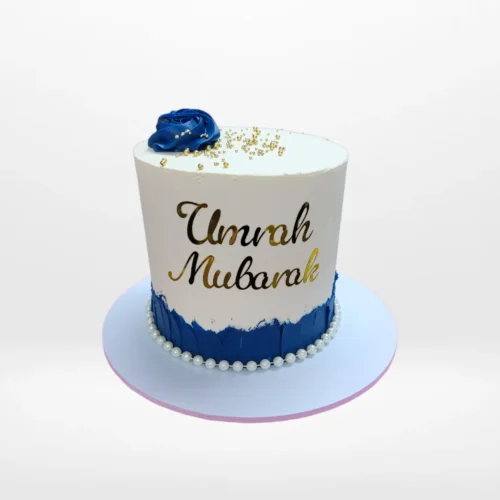 Umrah Mubarak cake with elegant design and personalised message handcrafted in Birmingham.