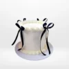 White celebration cake with smooth buttercream finish made in Birmingham.