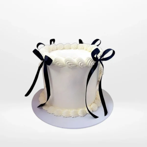 White celebration cake with smooth buttercream finish made in Birmingham.
